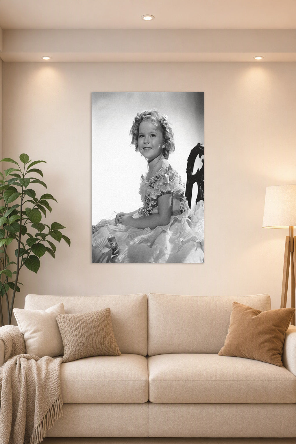 Shirley Temple in a bright living room above a beige sofa.