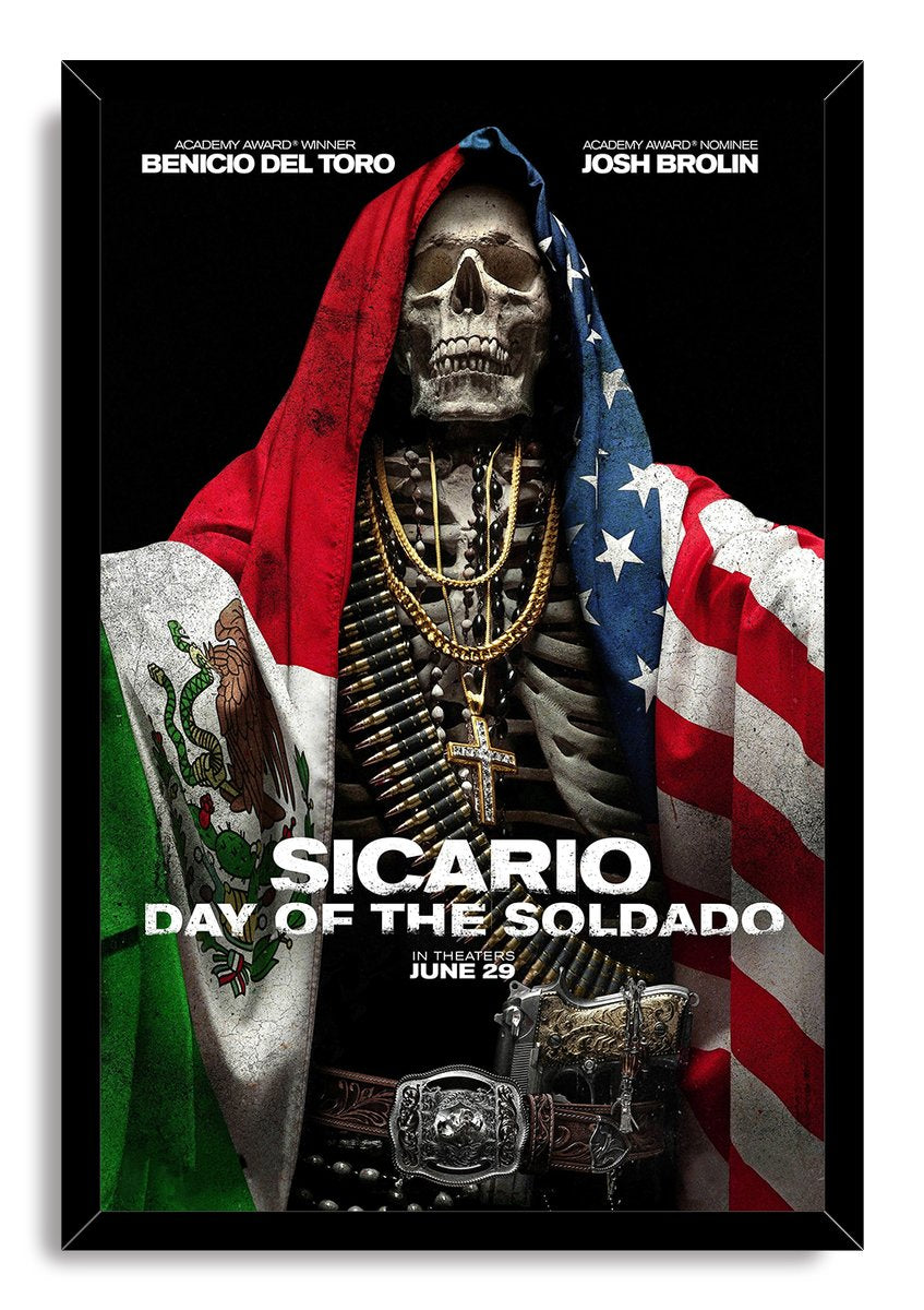 Sicario: Day of the Soldado framed wall art print presents a skeleton in Mexican and American flags with gold jewelry and ammunition.