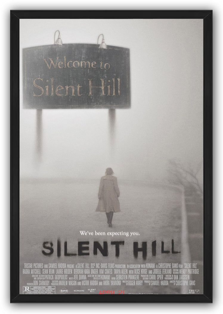 Silent Hill framed wall art print depicting a solitary woman under a weathered Welcome to Silent Hill sign in gray mist.