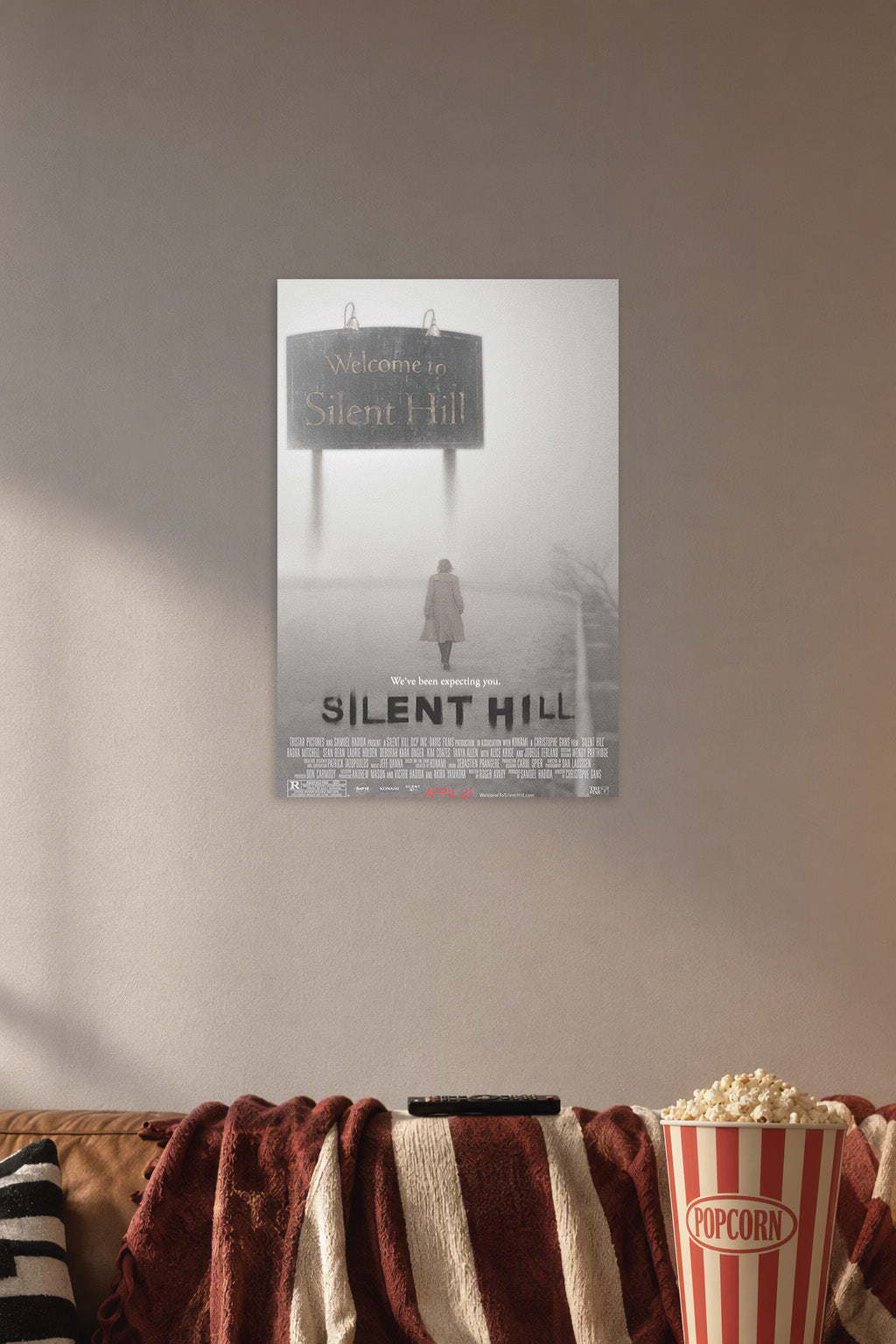 Silent Hill Movies in a cozy movie room above a brown sofa with popcorn.