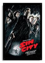 Sin City framed wall art print depicts a rain-soaked cast of noir characters with firearms, set in a black frame with red lettering.