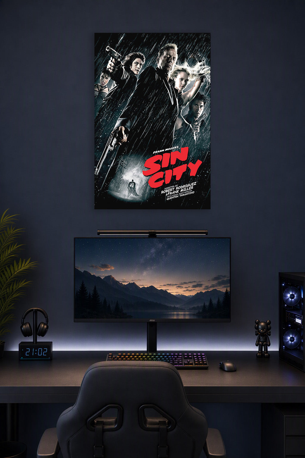 Sin City Movie Poster in a gaming desk setup above a monitor.