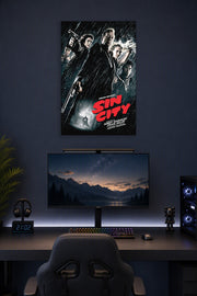 Sin City Movie Poster in a gaming desk setup above a monitor.