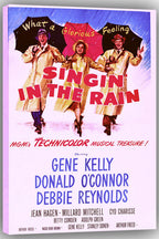 Singin' in the Rain wall art print featuring three yellow-coated dancers with umbrellas, bold red title lettering, and cast names.