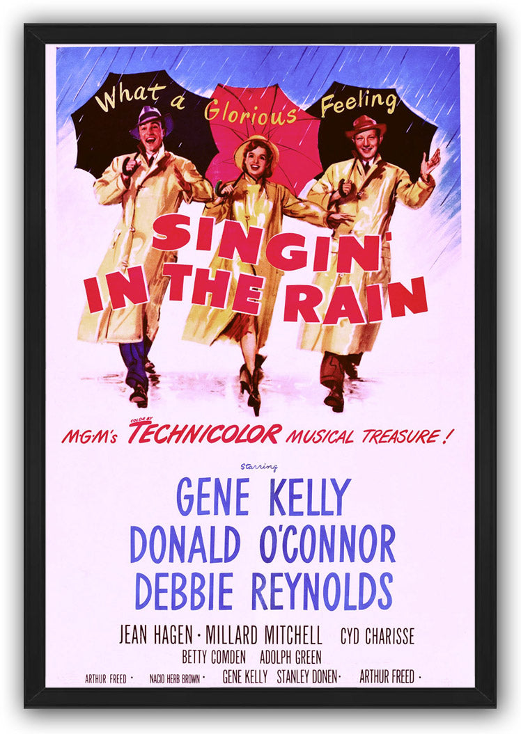 Framed Singin' in the Rain poster wall art with three raincoat-clad performers, umbrellas, red title text, and blue credits.