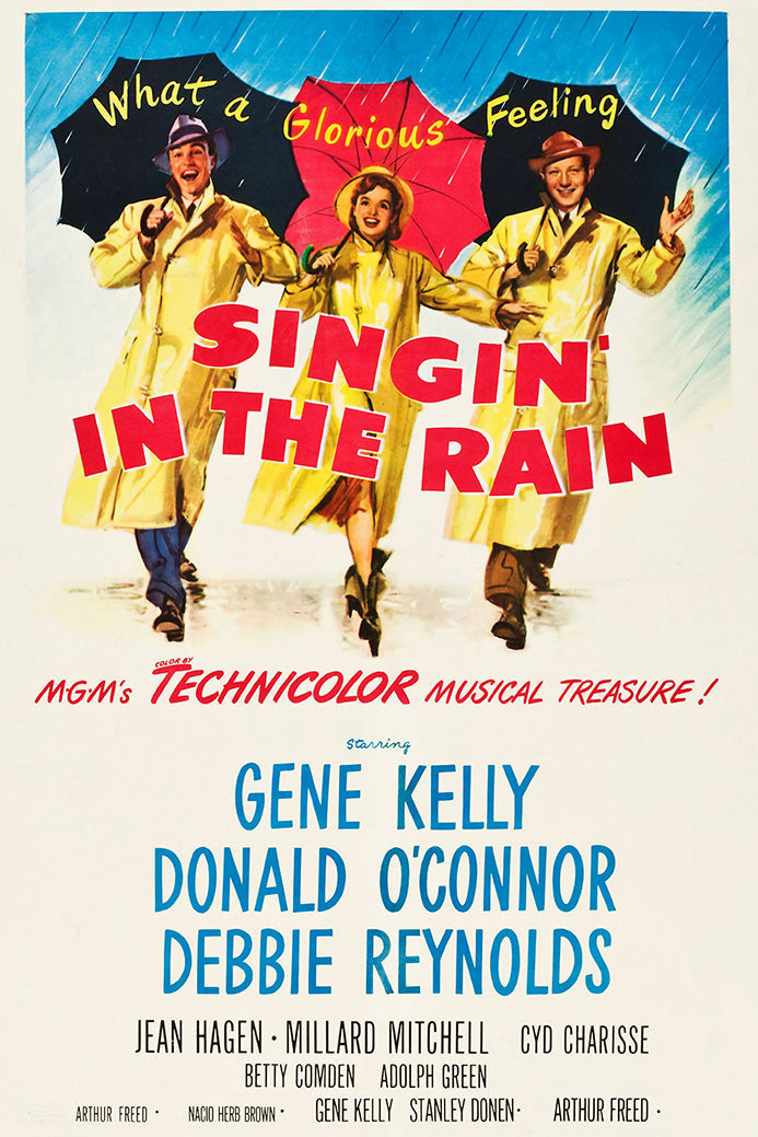 Singin' in the Rain poster with three performers in yellow raincoats holding black and red umbrellas beneath blue rain.