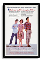 Sixteen Candles movie poster wall art print framed in black, featuring three teens and the handwritten-style title.