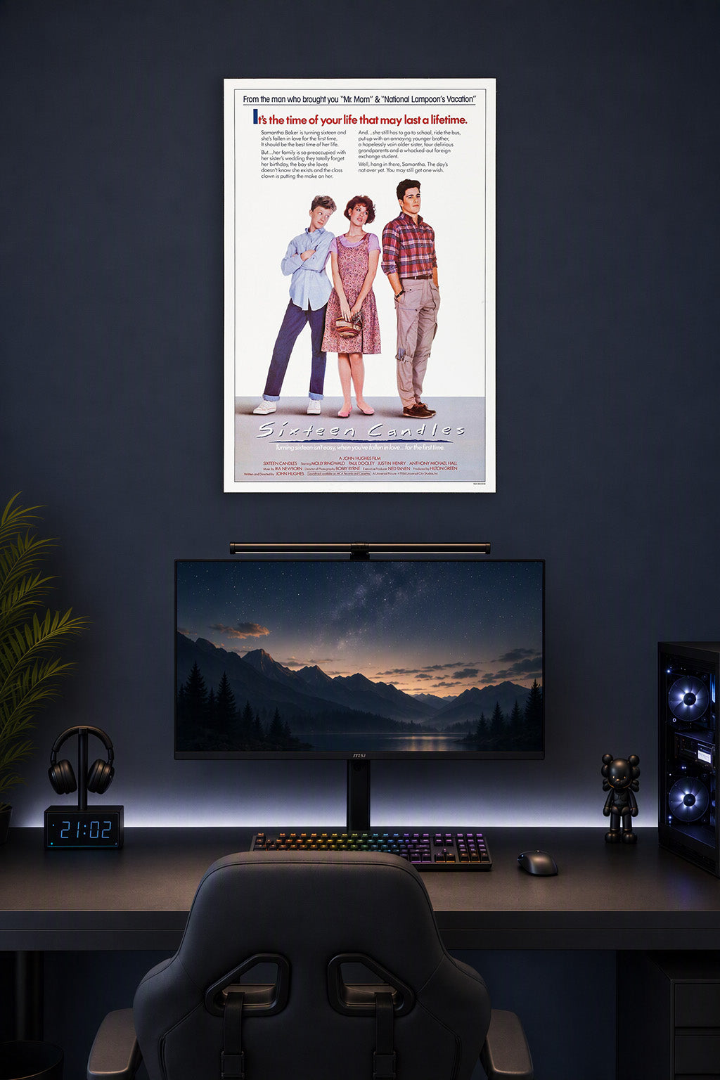 Sixteen Candles Movie Poster in a gaming desk setup above a monitor.