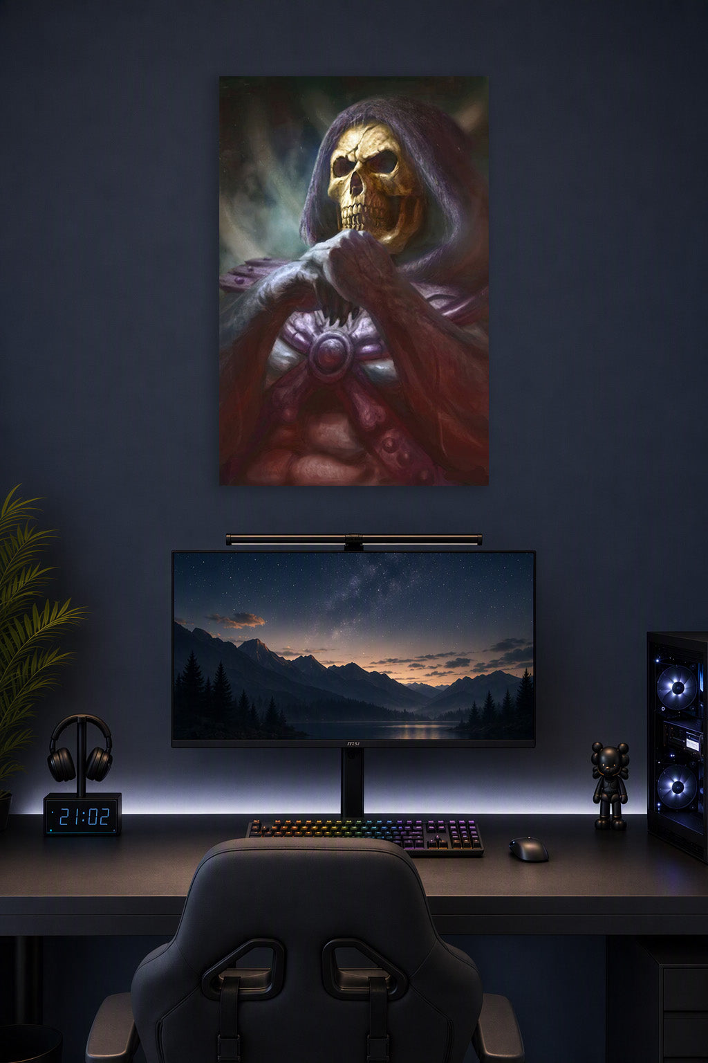 Skeletor in a gaming desk setup above a monitor.