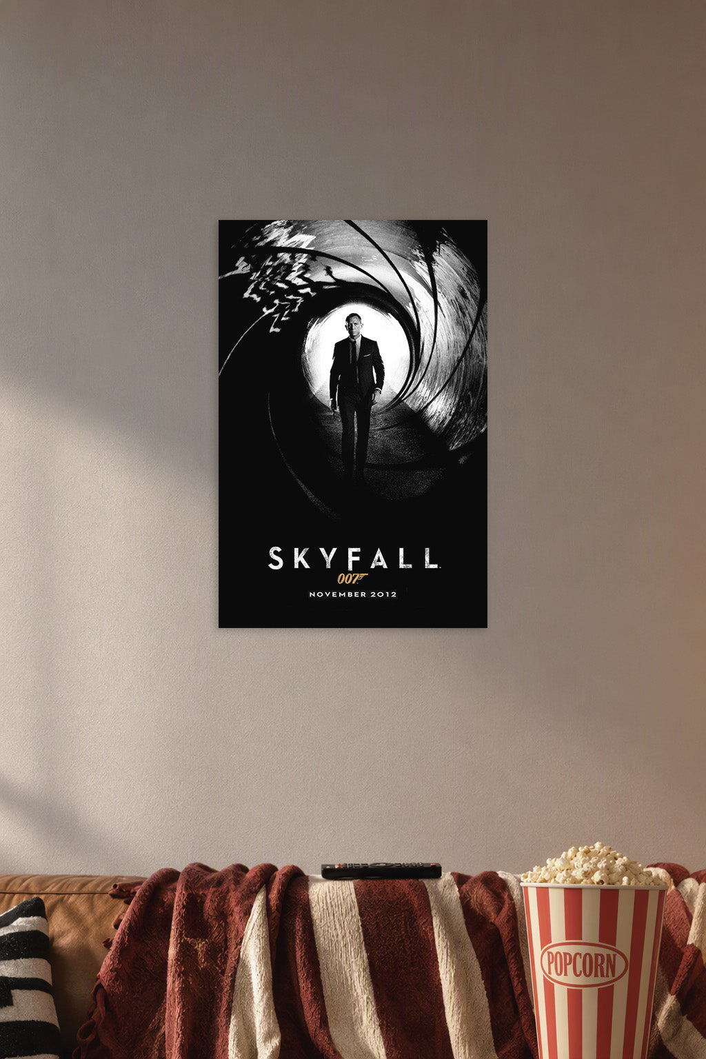 Skyfall James Bond Daniel Craig in a cozy movie room above a brown sofa with popcorn.