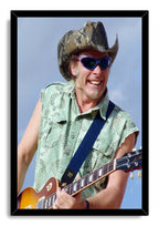 Guitarist framed wall art print featuring a smiling man in blue sunglasses and a camouflage cowboy hat playing a sunburst electric guitar.
