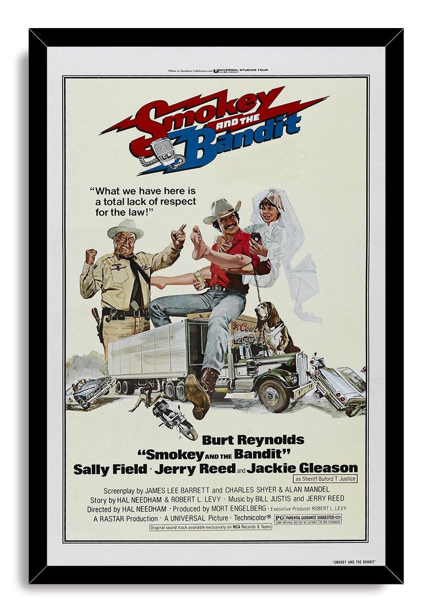Smokey and the Bandit framed wall art print in a black frame, with illustrated characters, a truck, dog, motorcycles, and wrecked cars.
