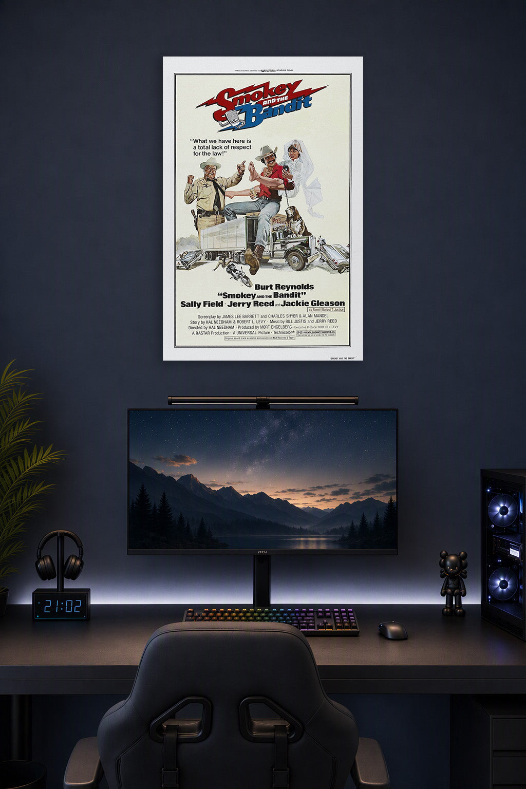 Smokey and the Bandit Movie Poster in a gaming desk setup above a monitor.