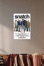 Snatch Movies in a cozy movie room above a brown sofa with popcorn.