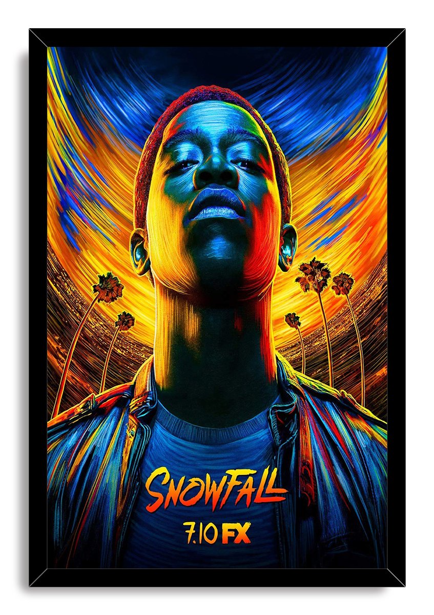 Framed Snowfall wall art print portrays Franklin Saint in a colorful upward-facing portrait with palm trees and 7.10 FX text.