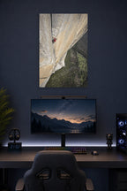 Solo Rock Climber in a gaming desk setup above a monitor.