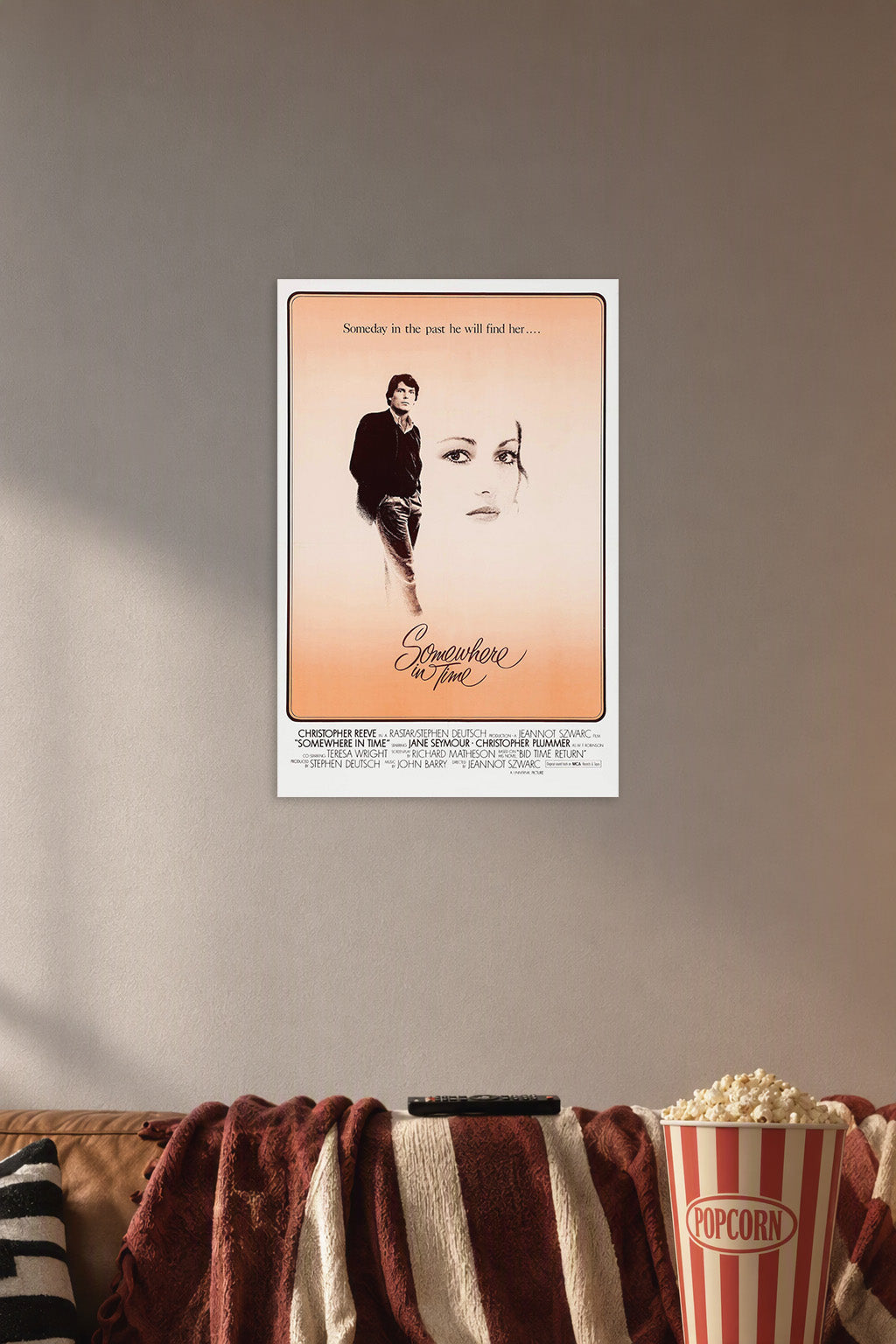 Somewhere in Time Movie in a cozy movie room above a brown sofa with popcorn.