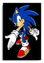 Sonic the Hedgehog framed wall art print portrays the blue character leaning forward in white gloves and red shoes against black.