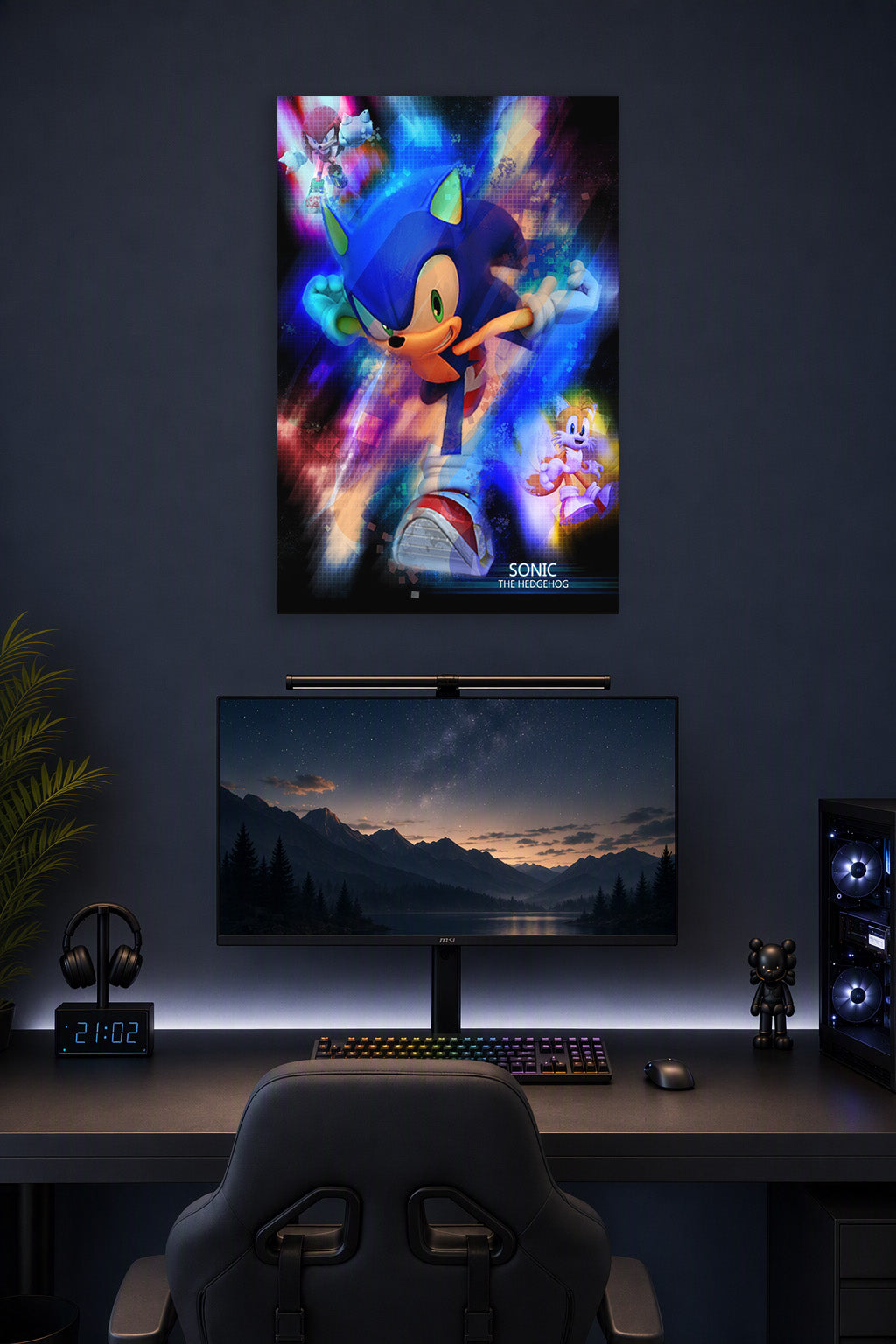 Sonic the Hedgehog in a gaming desk setup above a monitor.