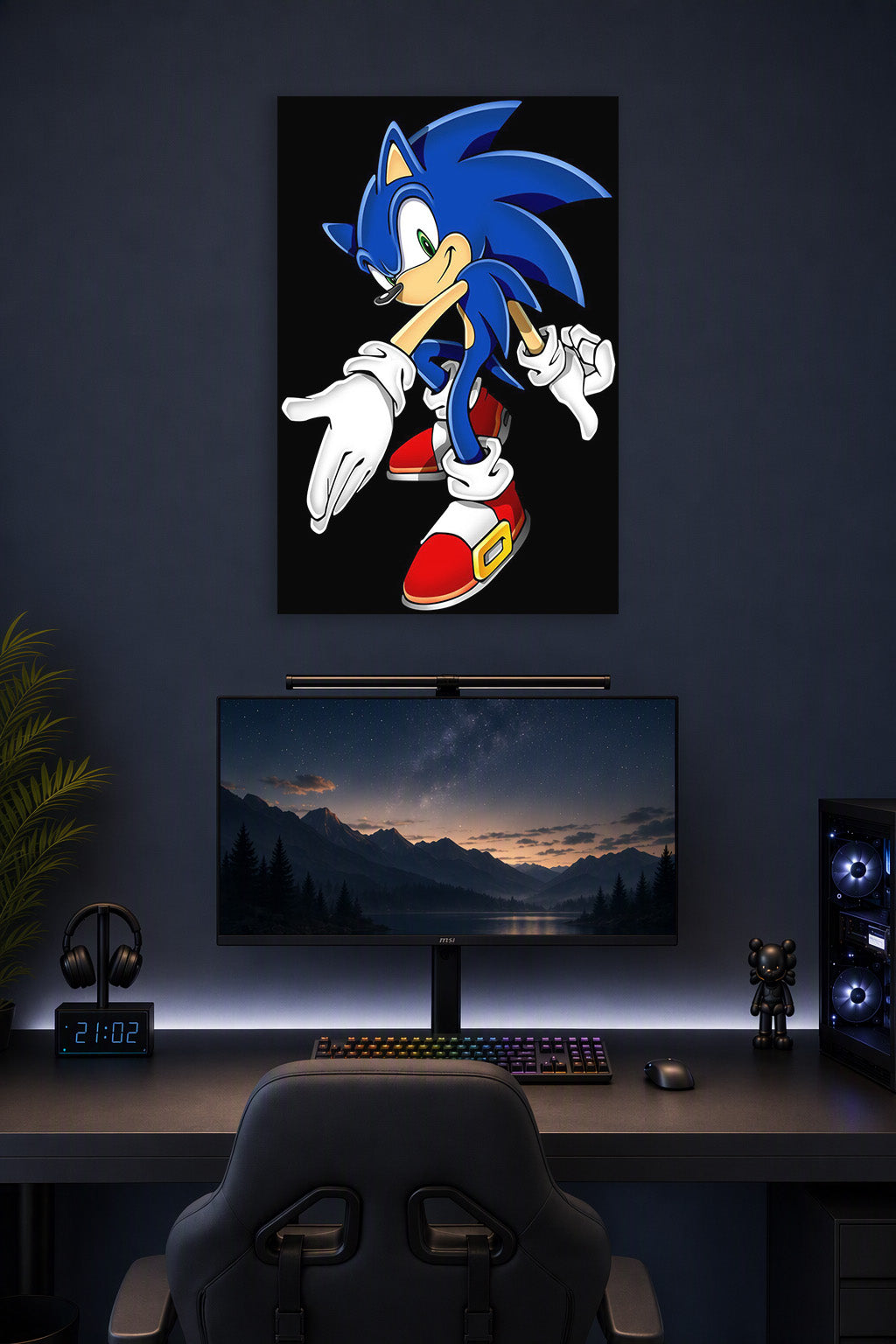 Sonic the Hedgehog in a gaming desk setup above a monitor.
