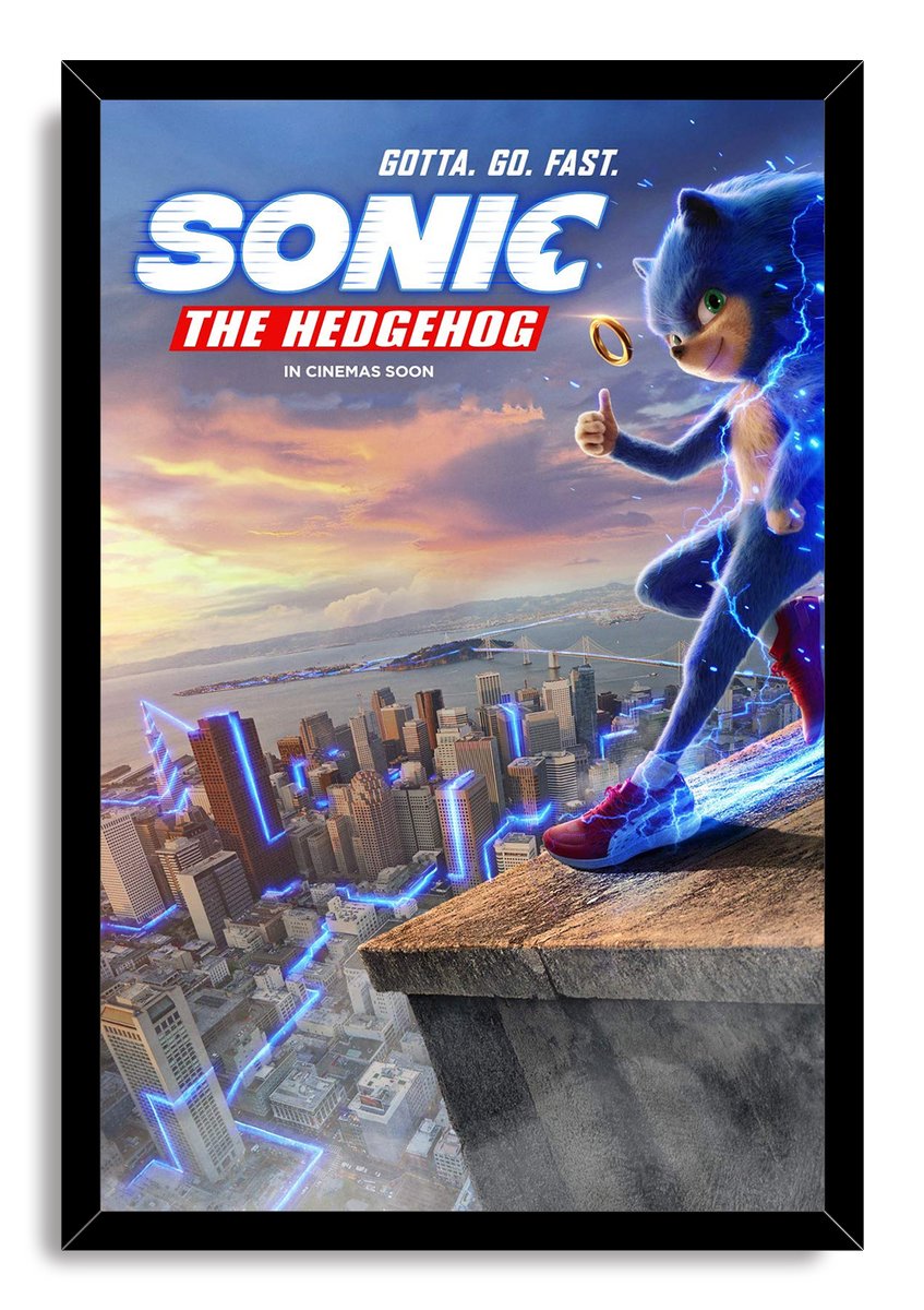 Sonic the Hedgehog framed wall art print depicts the blue hedgehog giving a thumbs-up over a city at sunset with electric blue trails.