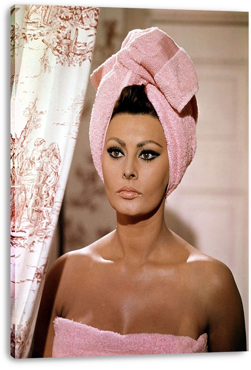 Sophia Loren canvas wall art print displays her in a pink towel turban and wrap against a softly lit interior.