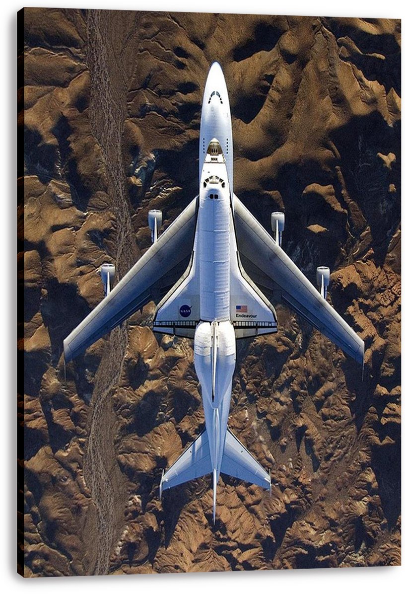 Space Shuttle Endeavour canvas wall art print displays the orbiter mounted on a 747, seen from above against rocky brown terrain.