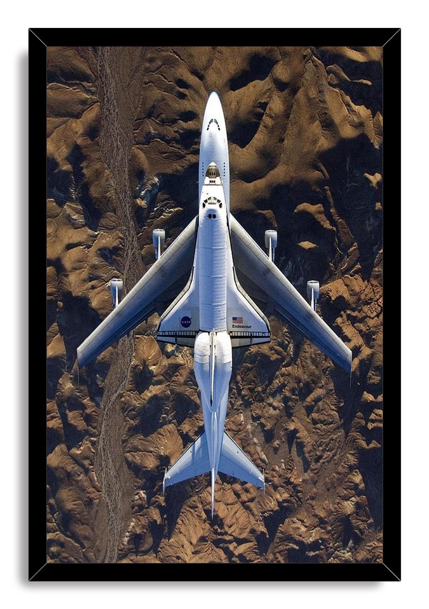 Space Shuttle Endeavour framed wall art print features the white shuttle atop its carrier aircraft over a textured desert landscape.