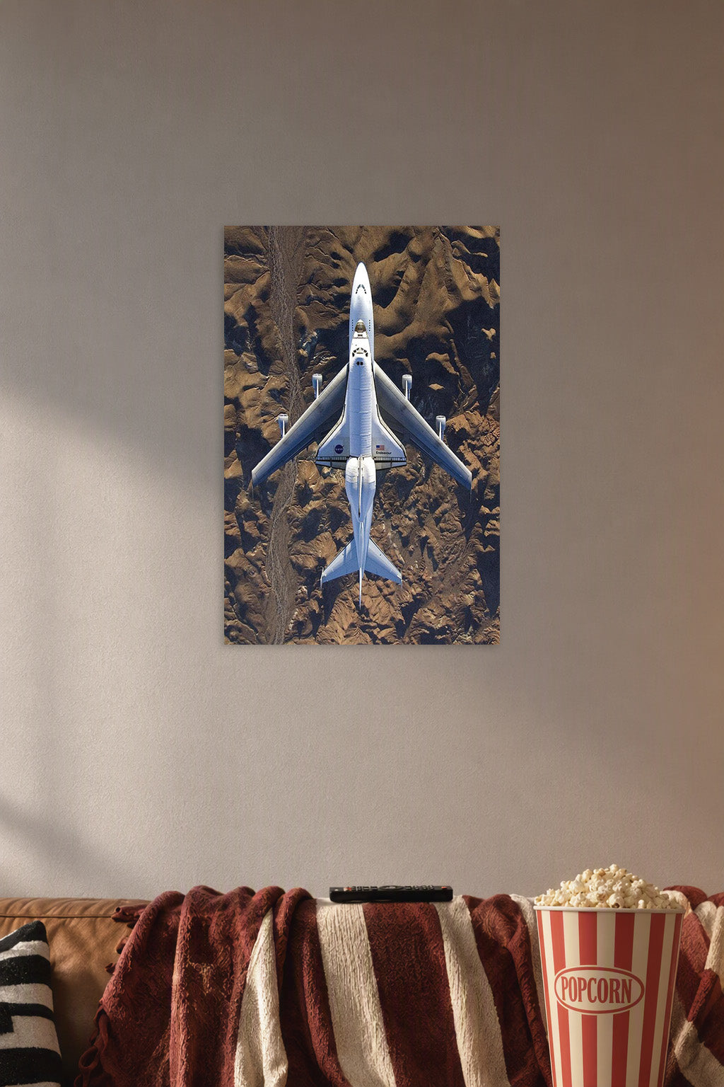 Space Shuttle Endeavour on Carrier Aircraft in a cozy movie room above a brown sofa with popcorn.