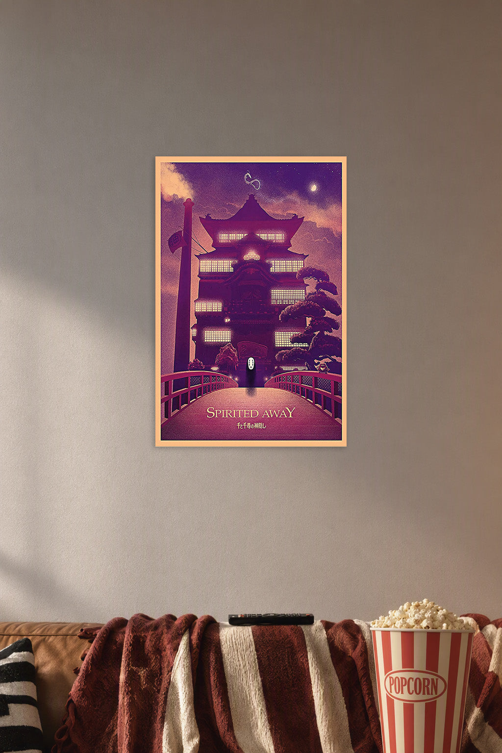 Spirited Away Bathhouse No-Face in a cozy movie room above a brown sofa with popcorn.
