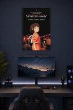 Spirited Away in a gaming desk setup above a monitor.