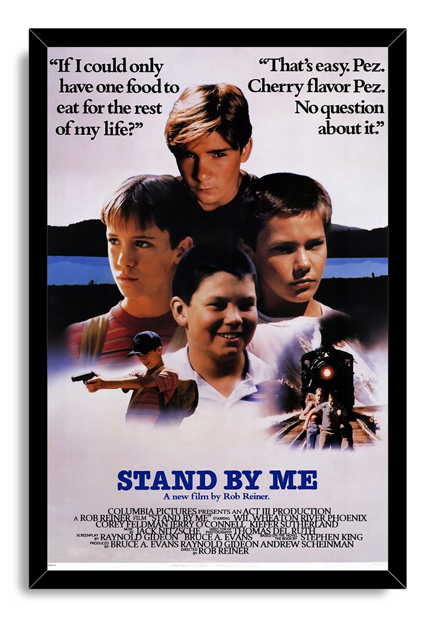 Stand By Me framed wall art print with a black border, four boys' portraits, quoted dialogue, and a train on the tracks.