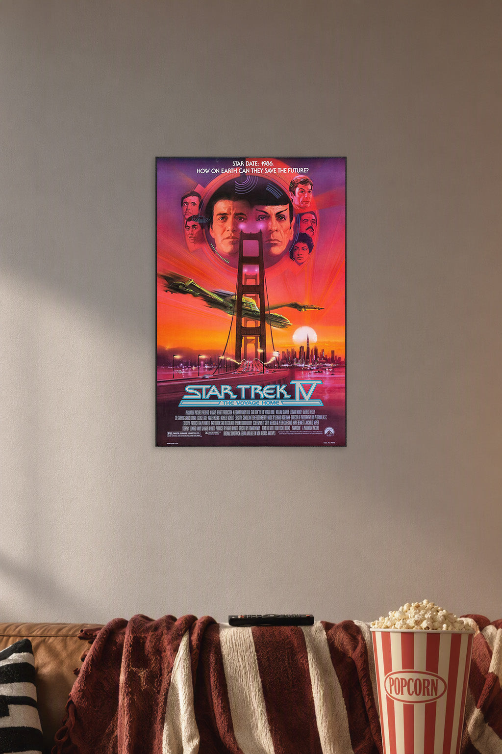 Star Trek IV: The Voyage Home in a cozy movie room above a brown sofa with popcorn.