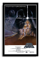 Star Wars poster in a black frame featuring Luke's glowing lightsaber, Leia, Darth Vader, the Death Star, and flying spacecraft.