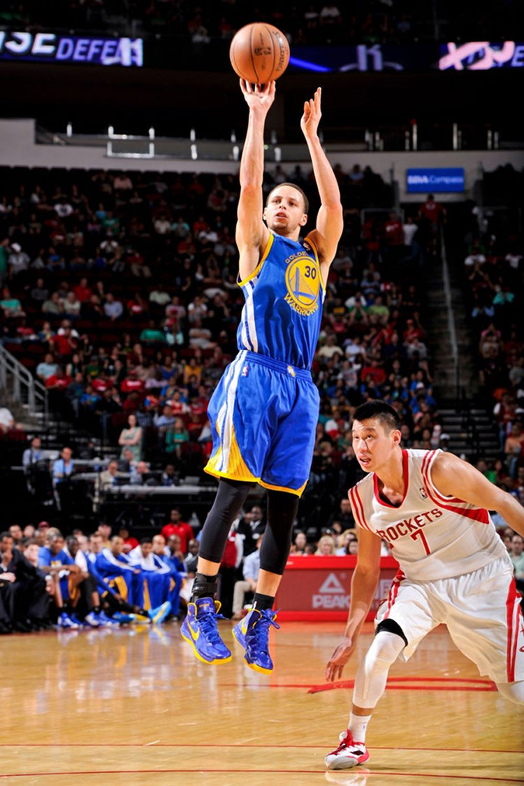 Stephen Curry basketball wall art print captures him rising for a shot in blue Warriors number 30 uniform over a Rockets defender.
