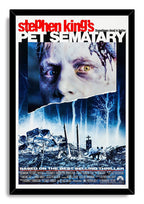 Pet Sematary framed wall art print with a black border, eerie face, moonlit blue cemetery, tombstones, and cat.