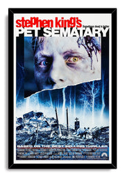Pet Sematary framed wall art print with a black border, eerie face, moonlit blue cemetery, tombstones, and cat.