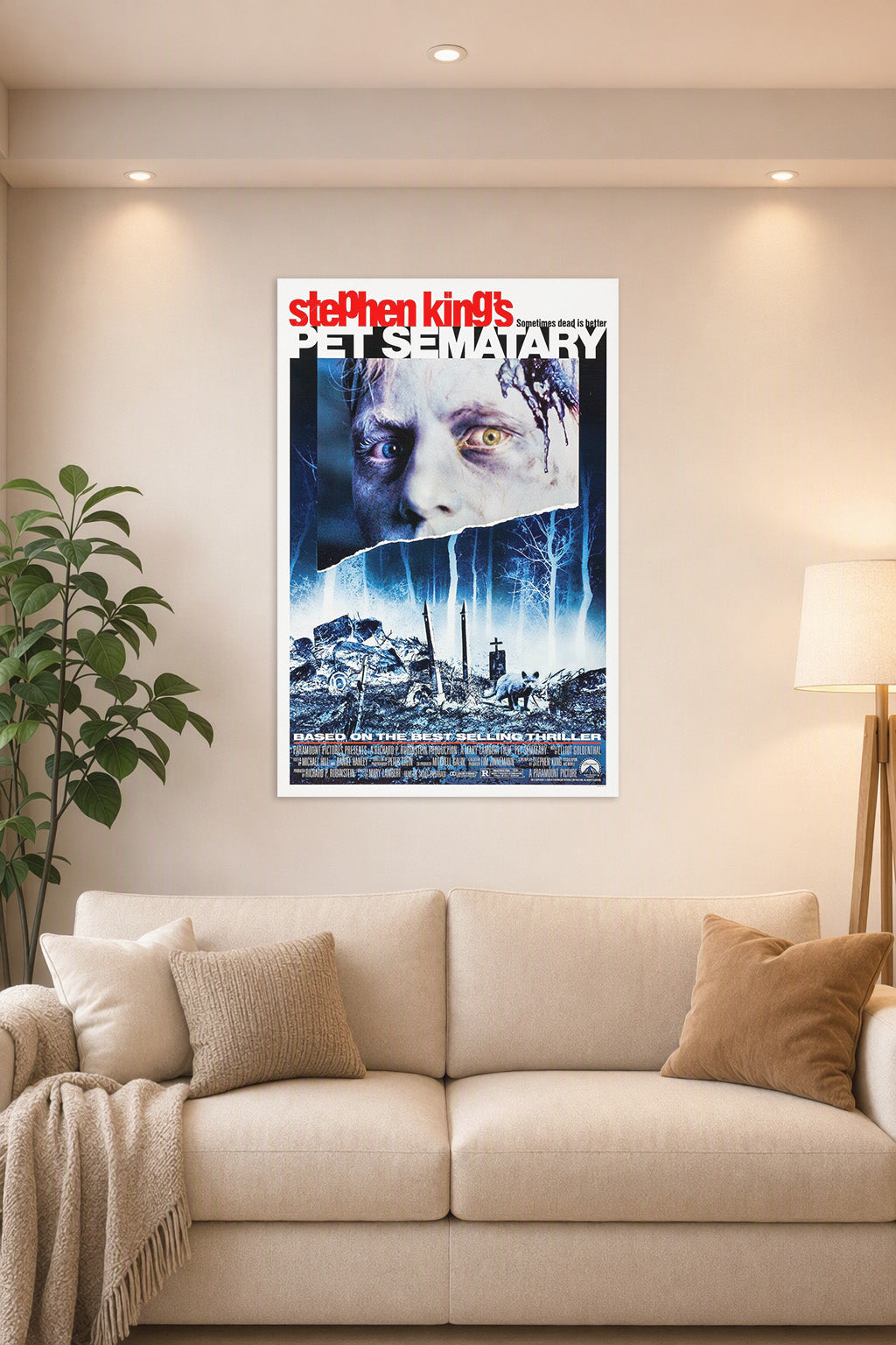 Stephen King's Pet Sematary Movie Poster in a bright living room above a beige sofa.
