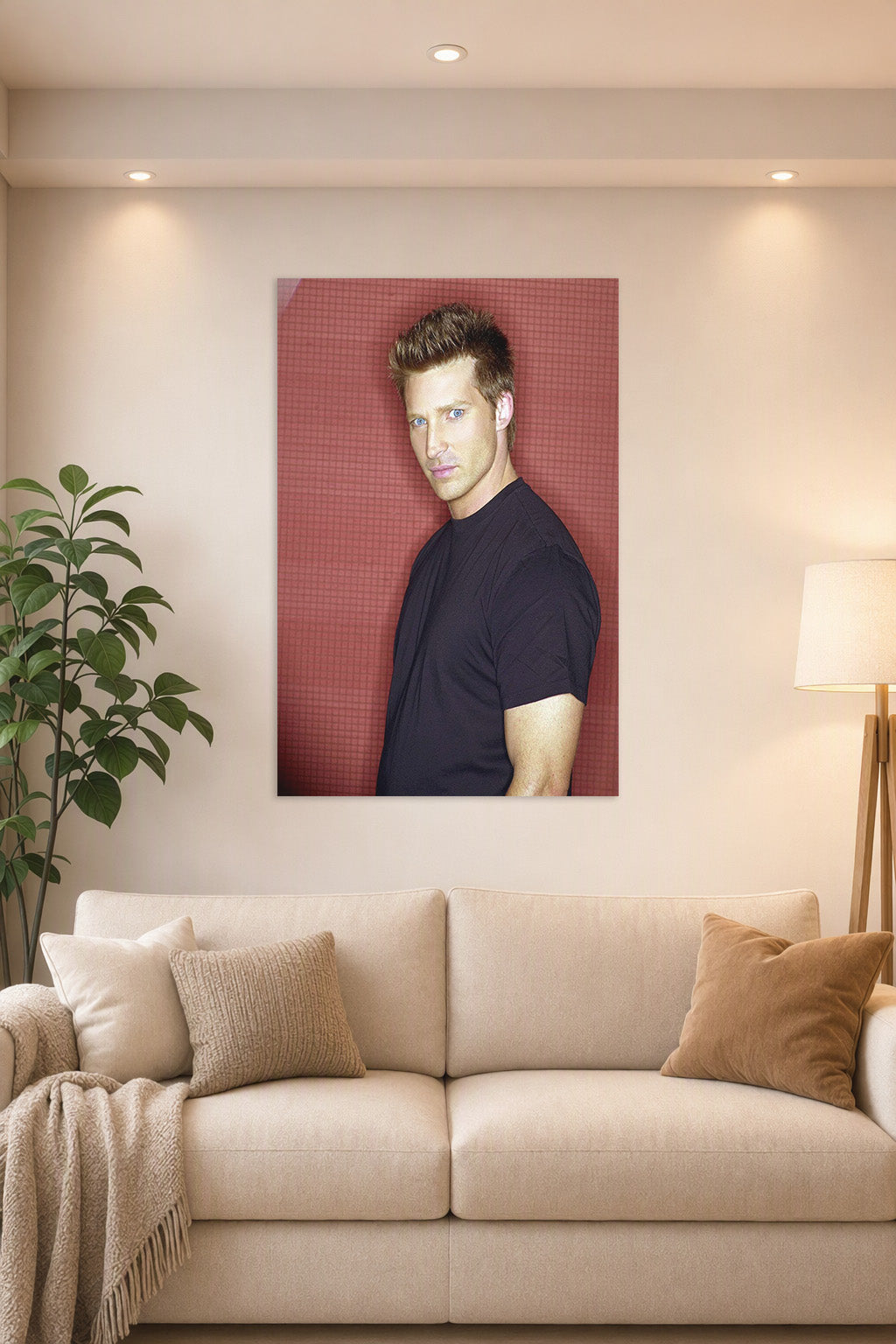 Steve Burton in a bright living room above a beige sofa.