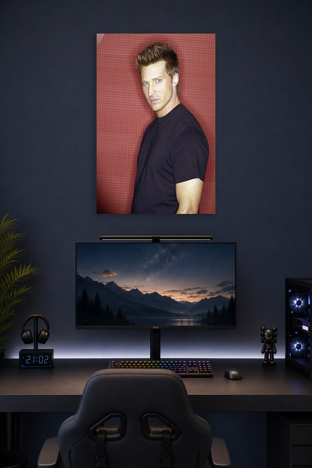 Steve Burton in a gaming desk setup above a monitor.