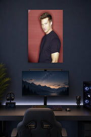 Steve Burton in a gaming desk setup above a monitor.