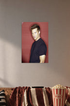 Steve Burton in a cozy movie room above a brown sofa with popcorn.