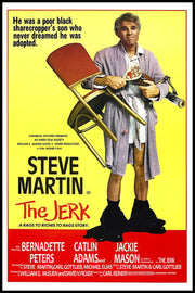 The Jerk movie poster print features Steve Martin in a bathrobe holding a chair, iron, and lamp on yellow and red.