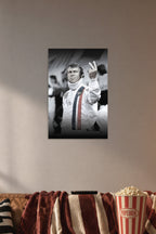 Steve McQueen in a cozy movie room above a brown sofa with popcorn.