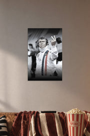 Steve McQueen in a cozy movie room above a brown sofa with popcorn.