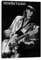 Stevie Ray Vaughan wall art print on canvas portrays the guitarist playing an electric guitar in monochrome, with name text above.