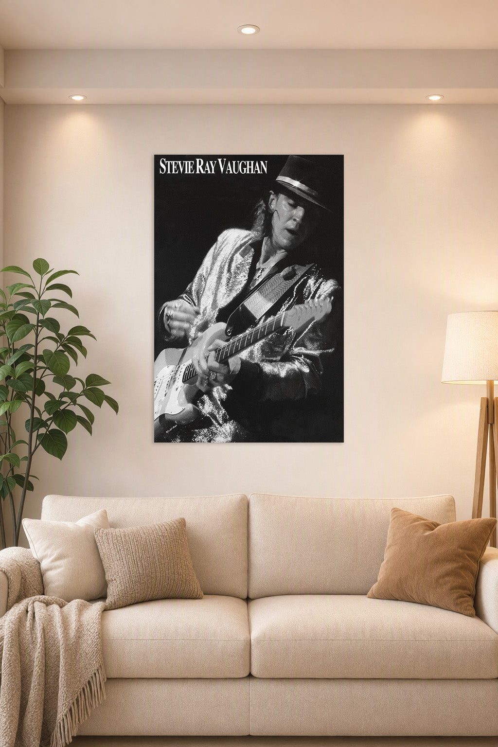 Stevie Ray Vaughan in a bright living room above a beige sofa.
