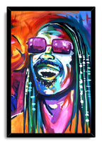 Stevie Wonder framed wall art print displays a vibrant smiling portrait in purple sunglasses, surrounded by a sleek black frame.