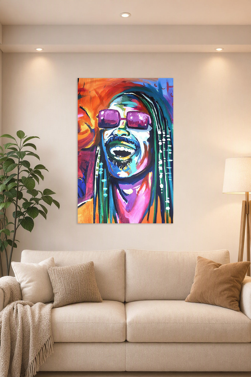 Stevie Wonder in a bright living room above a beige sofa.