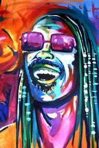 Stevie Wonder wall art print features a smiling close-up portrait with purple sunglasses, beaded braids, and vivid orange, blue, and pink brushstrokes.